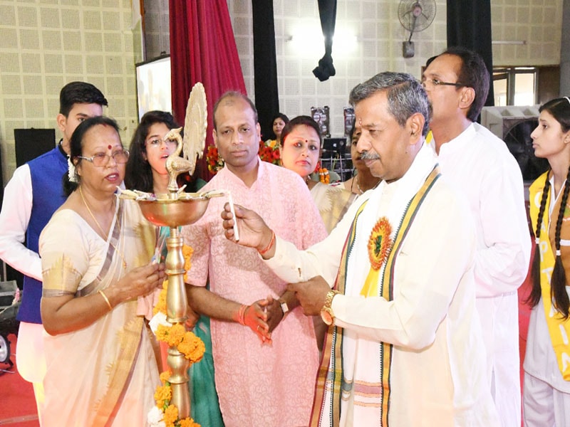 prof. bhuvnesh sharma and other dignitaries are lighting the lamp