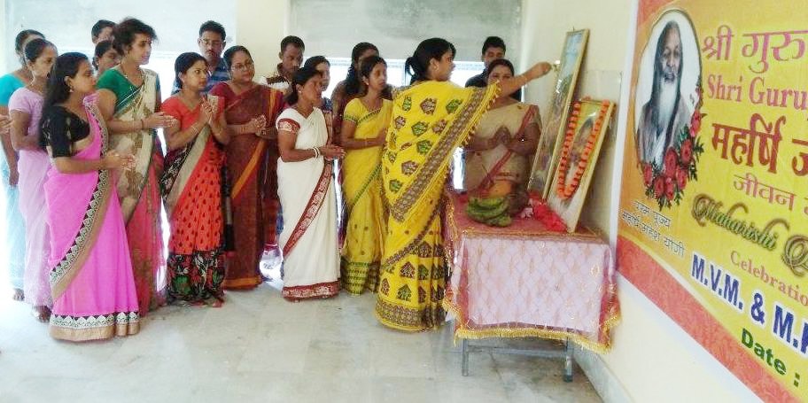 teachers, staff and all students of mvm jorhat performing guru parampara pujan