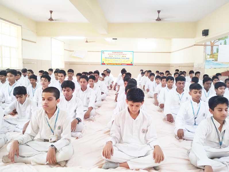 Group of boys practicing Transcendental Meditation at Maharishi Vidya Mandir, Hyderabad on the occasion of 9th International Yoga Day.