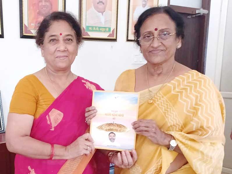 Smt. Puja Chandola, Principal of MVM Naini has present Brahmachari Girish Ji's book 
