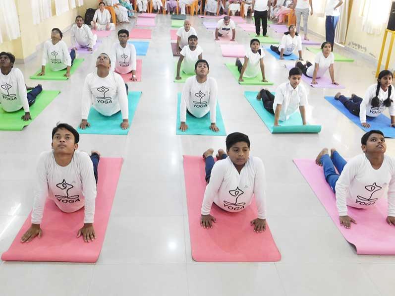  group of boys practicing Yoga on the occasion of 